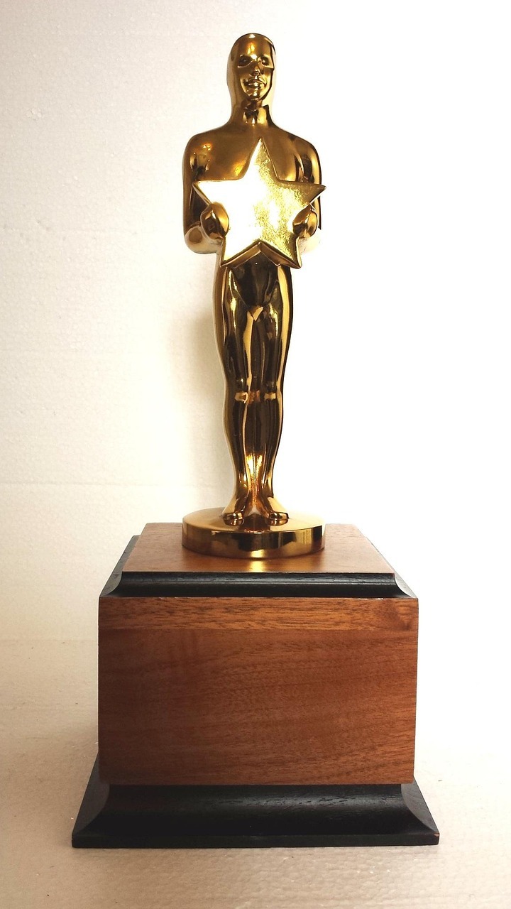 A golden statuette on a wooden base, strongly resembling an Oscar.