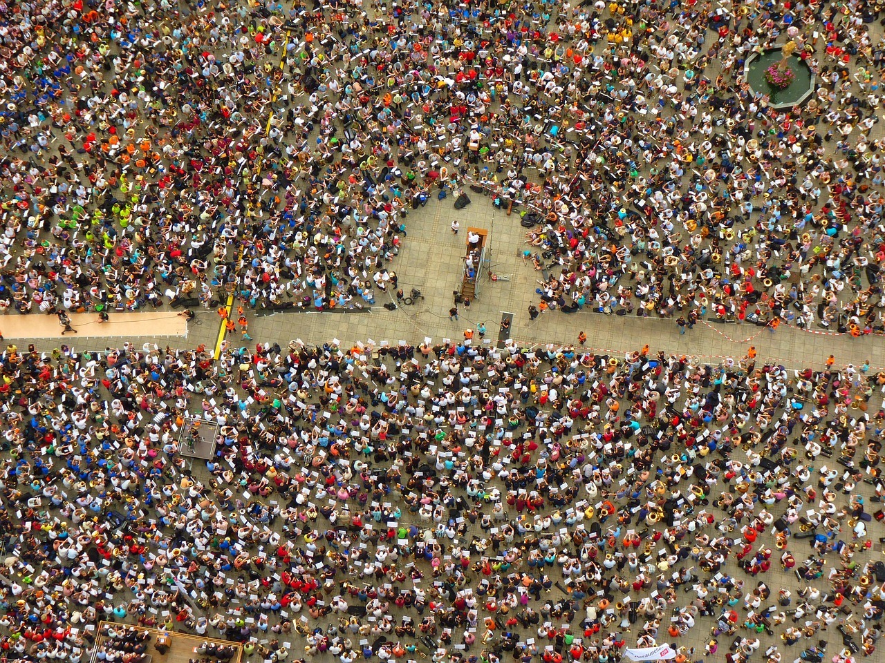 An overhead view of a large crowd protesting.